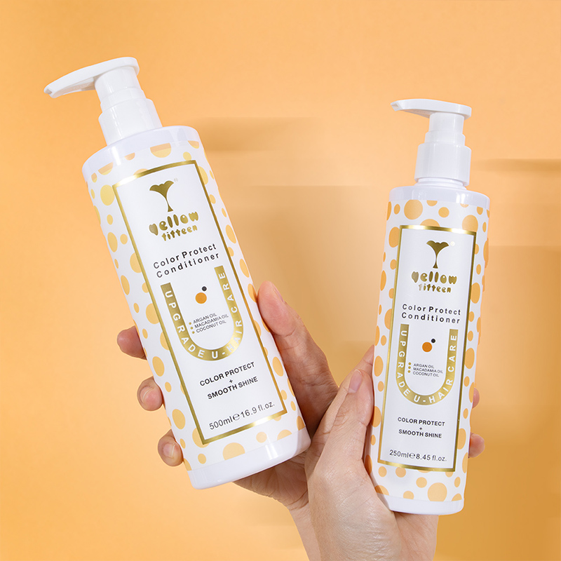 Two White bottles of Yellow Titteen Color Protect Conditioner with a yellow polka-dot pattern held by hands against a yellow background.