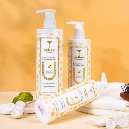 Three white pump bottles with yellow polka dots and gold labels, Color Protect Conditioner hair care set on a yellow backdrop.