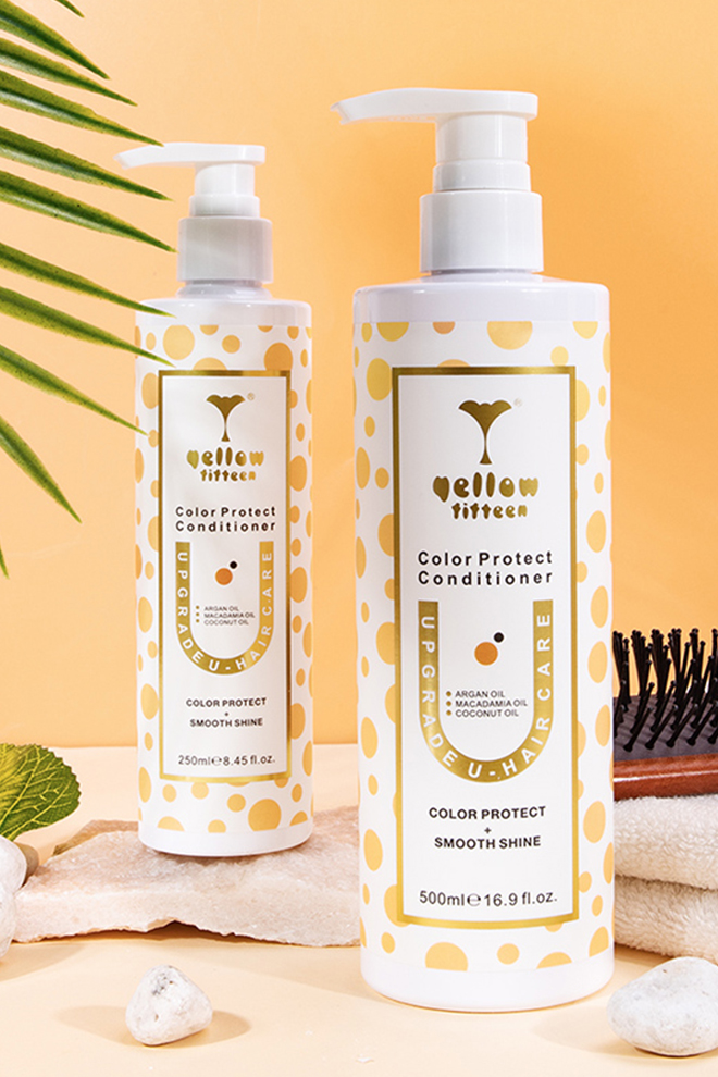 Two white pump bottles with yellow polka dots labeled Color Protect Conditioner on a peach background.