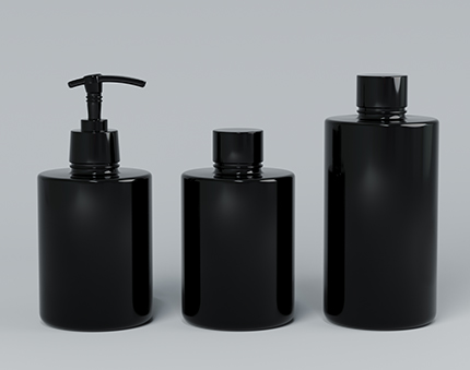 Three black cosmetic bottles of varying heights arranged in a row on a light gray background; the leftmost bottle has a pump dispenser.
