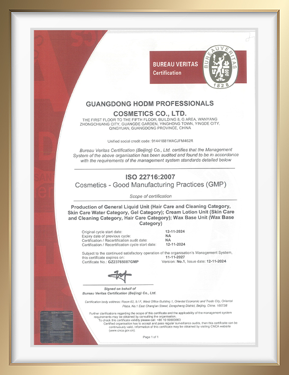 Framed ISO 22716 GMP certificate for Guangdong HODM Professionals Cosmetics Co., Ltd. with Bureau Veritas seal on a white background.